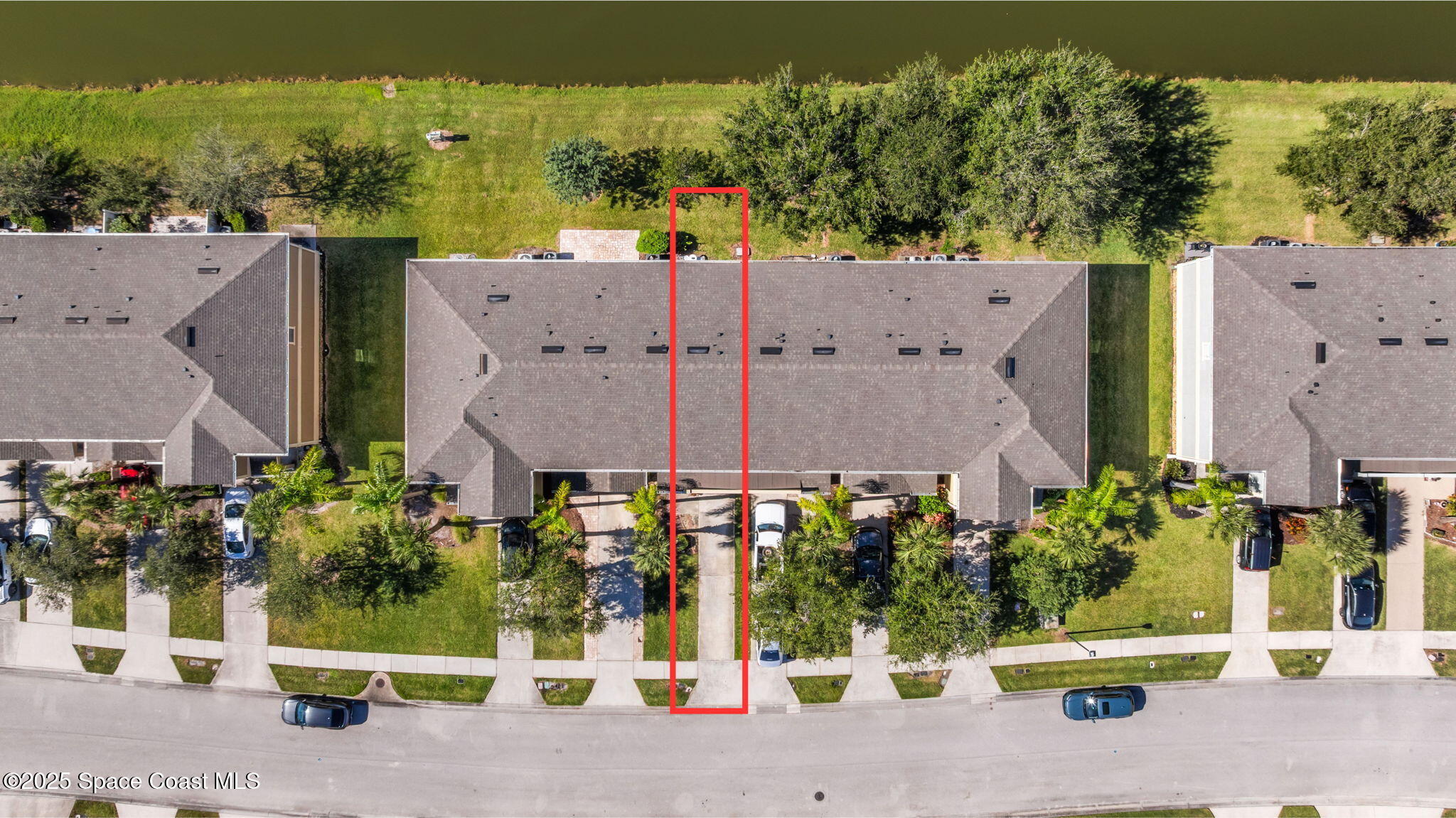 2690 Revolution Street, Unit 104 Melbourne, FL 32935 - Photo 27 of 35 an aerial view of a house with a yard and potted plants