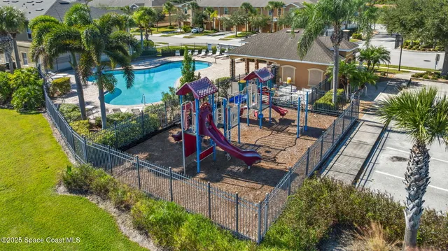 an outdoor space with seating area and swimming pool