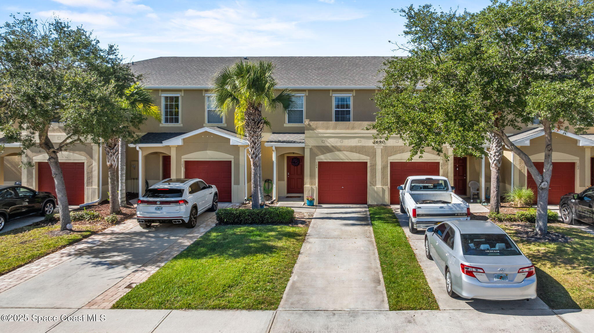 2690 Revolution Street, Unit 104 Melbourne, FL 32935 - Photo 34 of 35 a front view of a house with garden