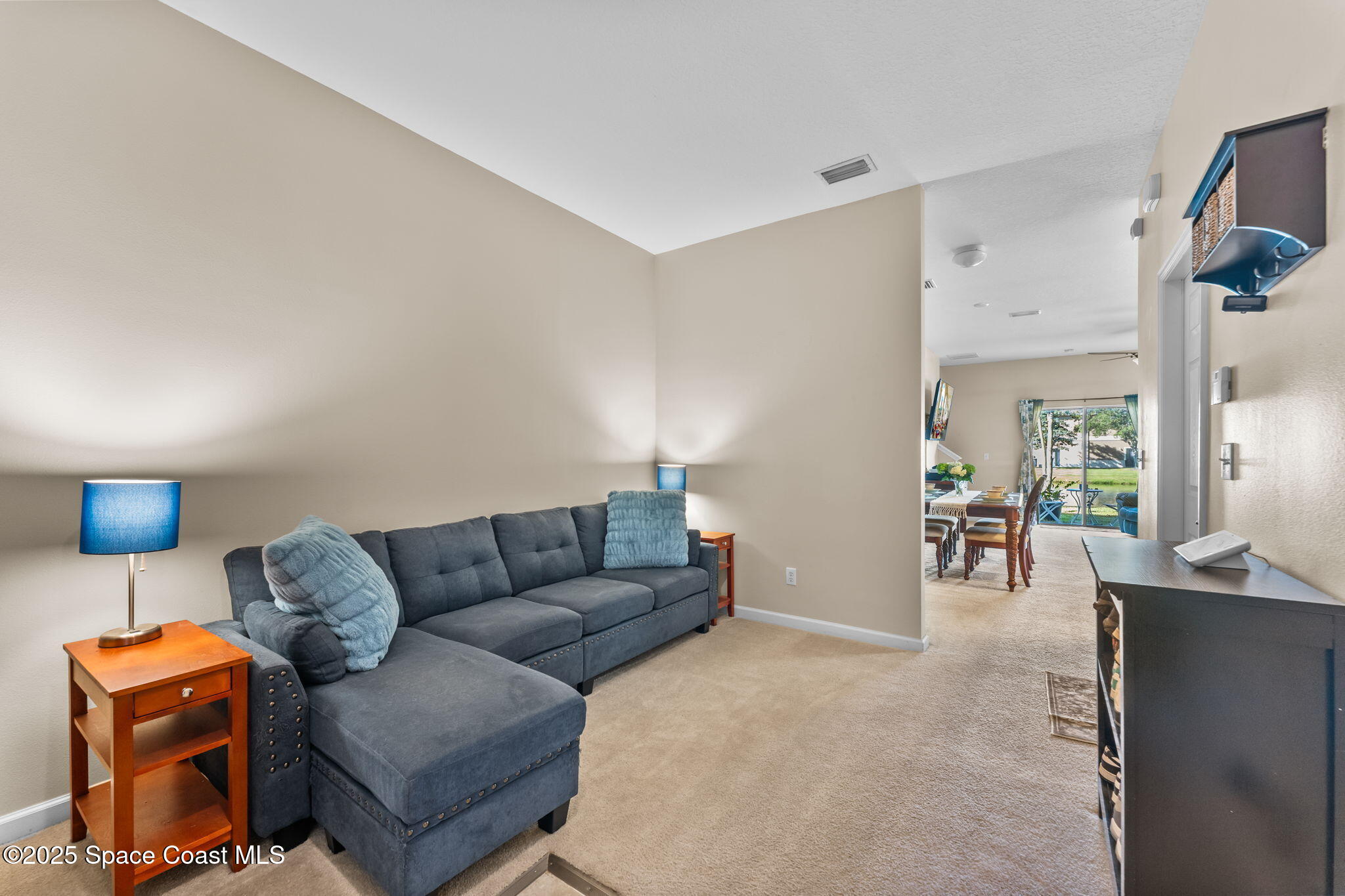 2690 Revolution Street, Unit 104 Melbourne, FL 32935 - Photo 4 of 35 a living room with furniture and a couch
