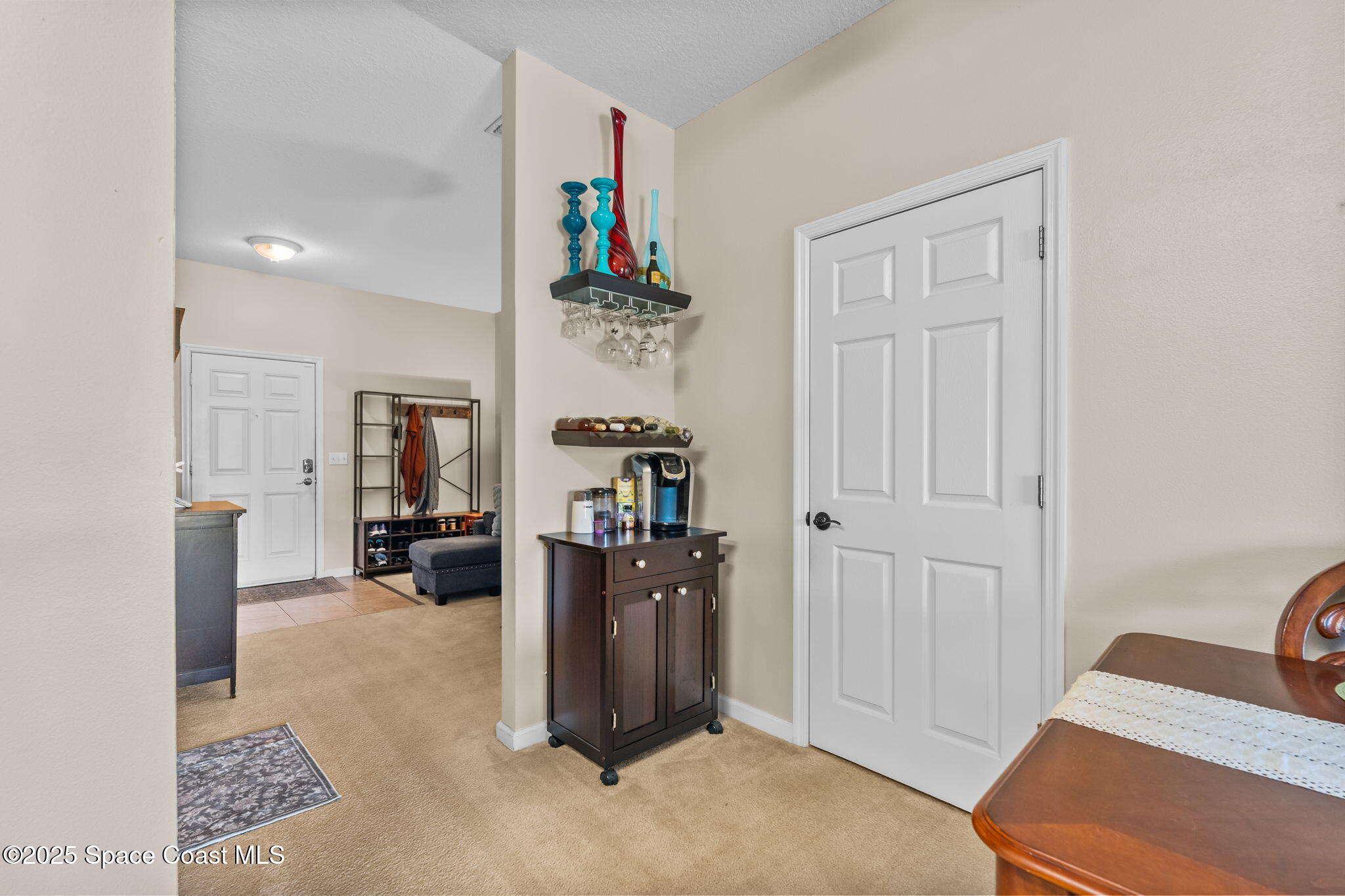 2690 Revolution Street, Unit 104 Melbourne, FL 32935 - Photo 5 of 35 a view of a livingroom with workspace and a couch