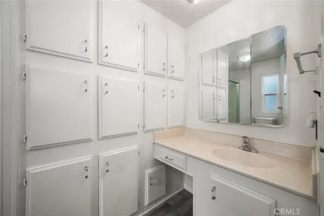 a white toilet sitting next to a bath tub