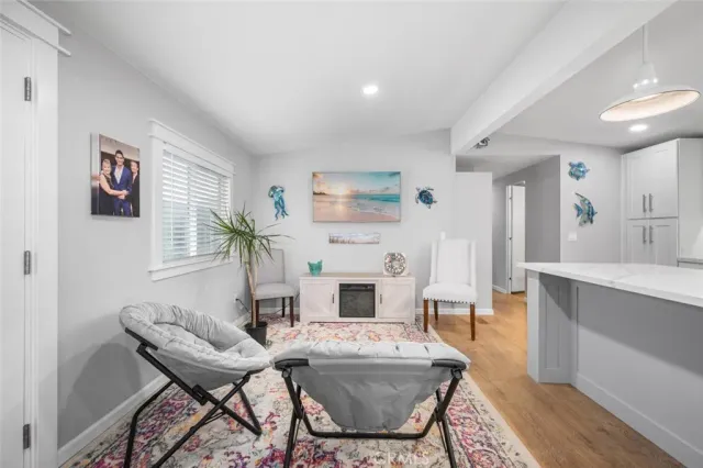 a large kitchen with stainless steel appliances and white cabinets