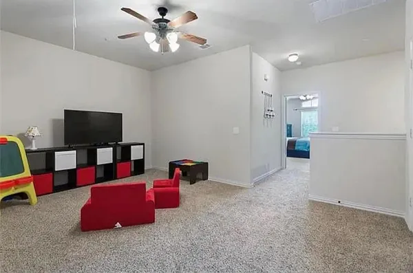 a view of living room with furniture and a flat screen tv