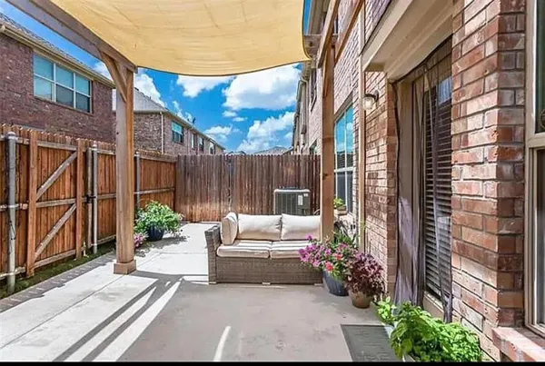 a view of a patio with couches and potted plants