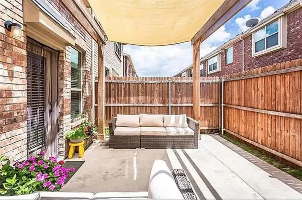 a view of a balcony with furniture