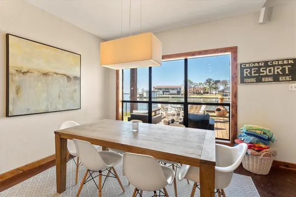 a dining room with furniture and window