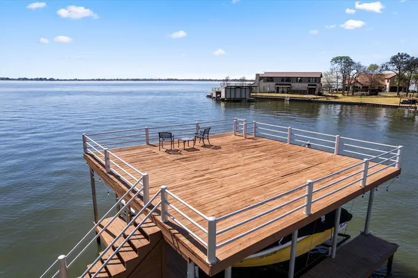 a outdoor sitting area with lake view