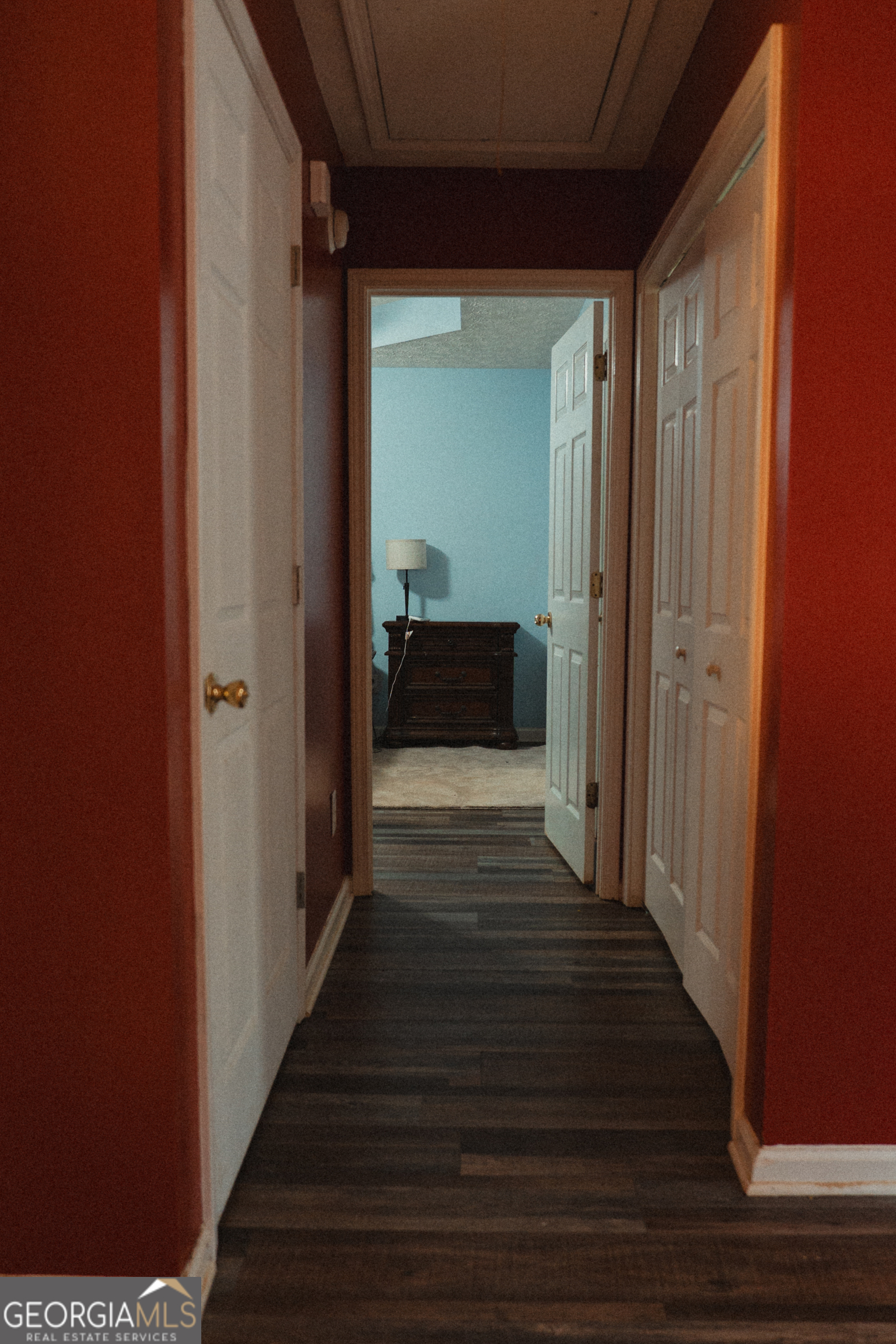 1145 Larkspur Drive Locust Grove, GA 30248 - Photo 13 of 15 a view of a hallway with wooden floor