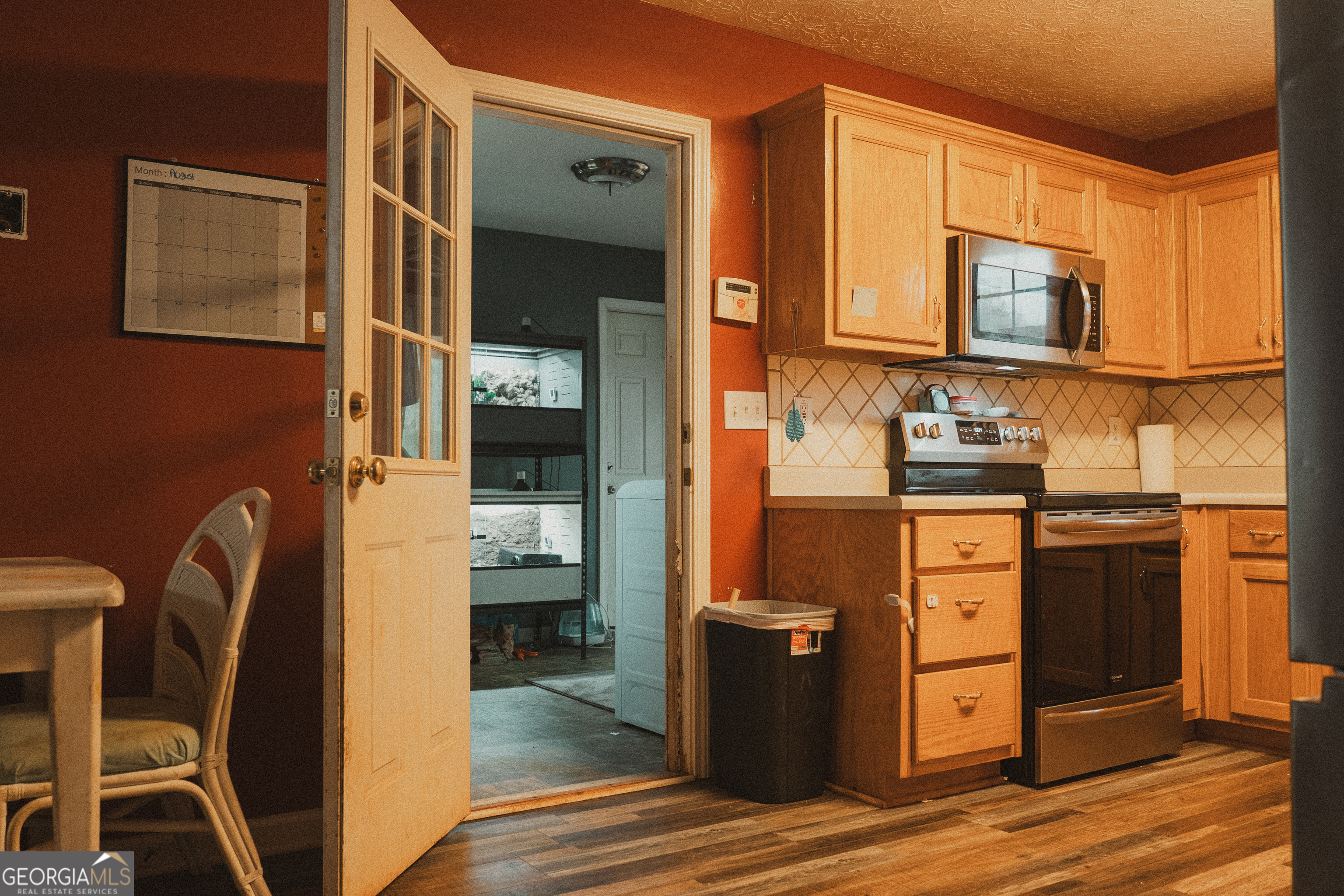 1145 Larkspur Drive Locust Grove, GA 30248 - Photo 14 of 15 a kitchen with stainless steel appliances granite countertop a refrigerator stove and sink