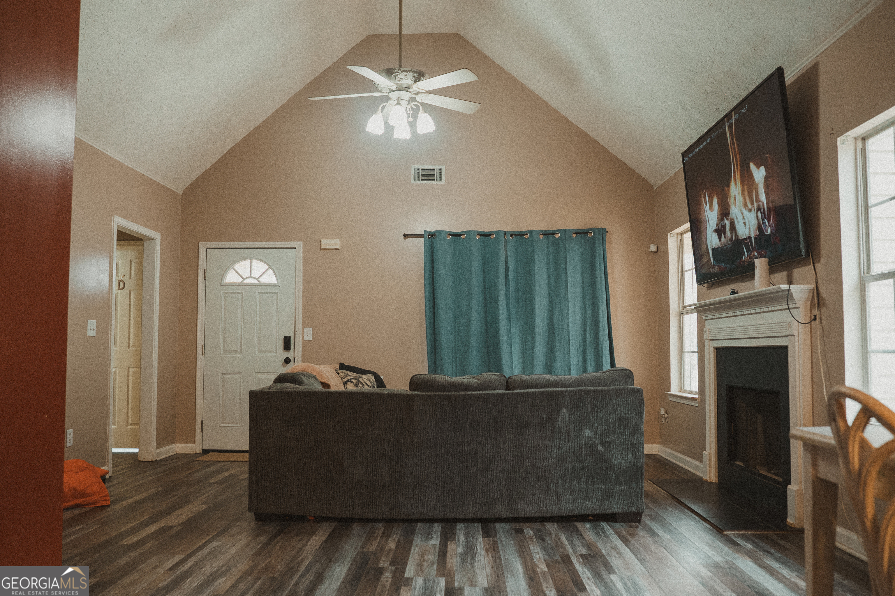 1145 Larkspur Drive Locust Grove, GA 30248 - Photo 2 of 15 a living room with furniture and a fireplace