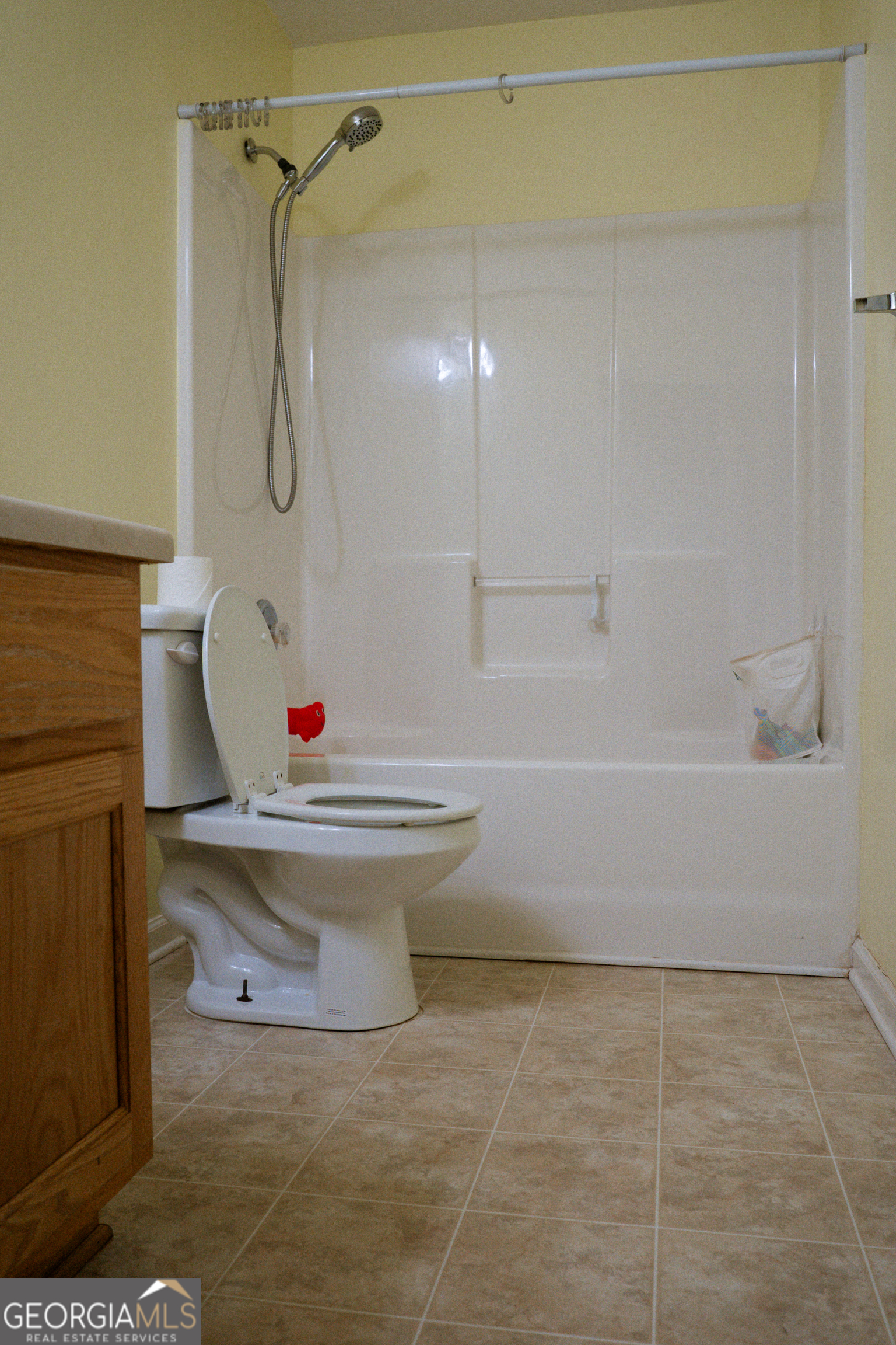 1145 Larkspur Drive Locust Grove, GA 30248 - Photo 3 of 15 a bathroom with a sink and a mirror
