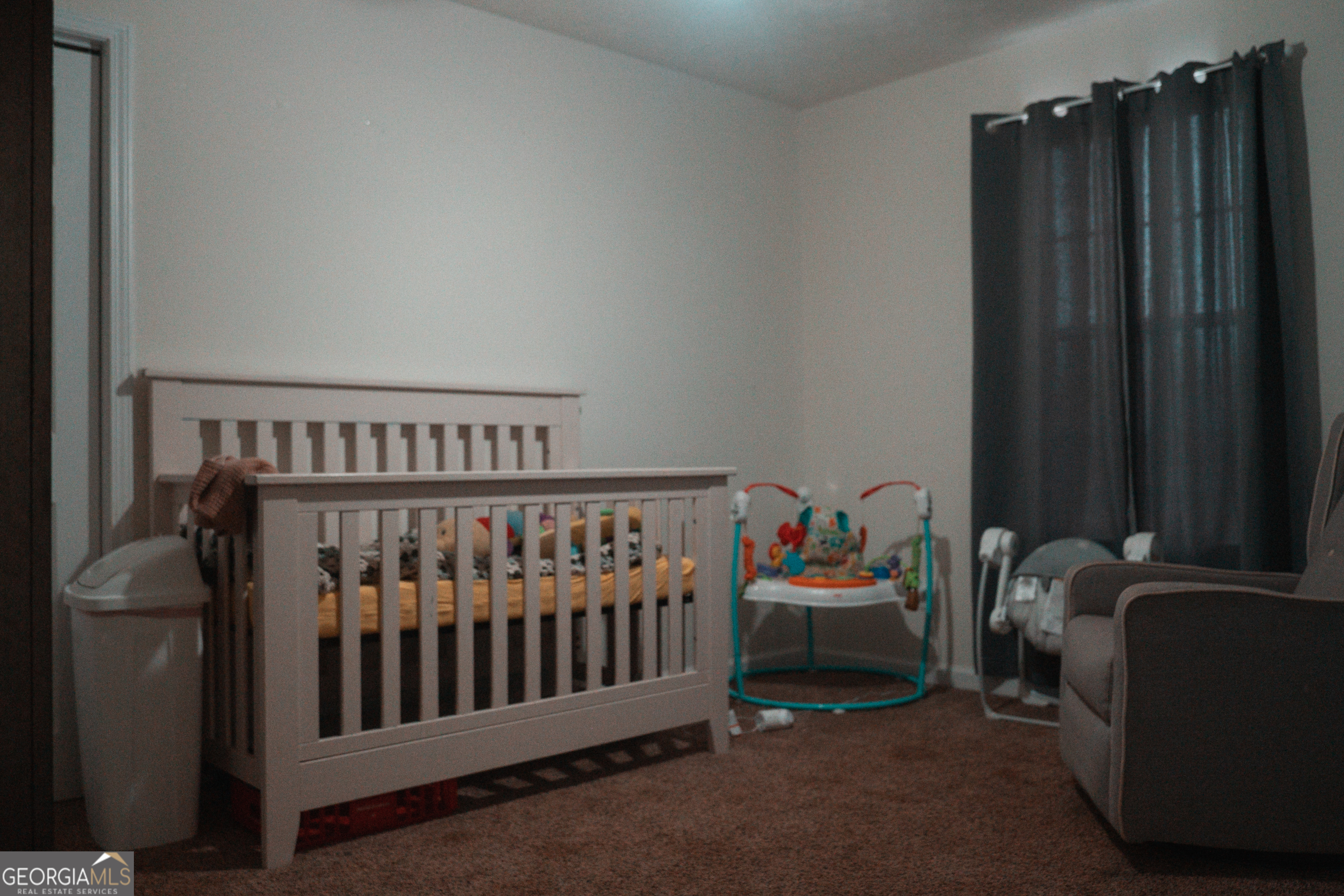 1145 Larkspur Drive Locust Grove, GA 30248 - Photo 4 of 15 a bedroom with furniture and a window