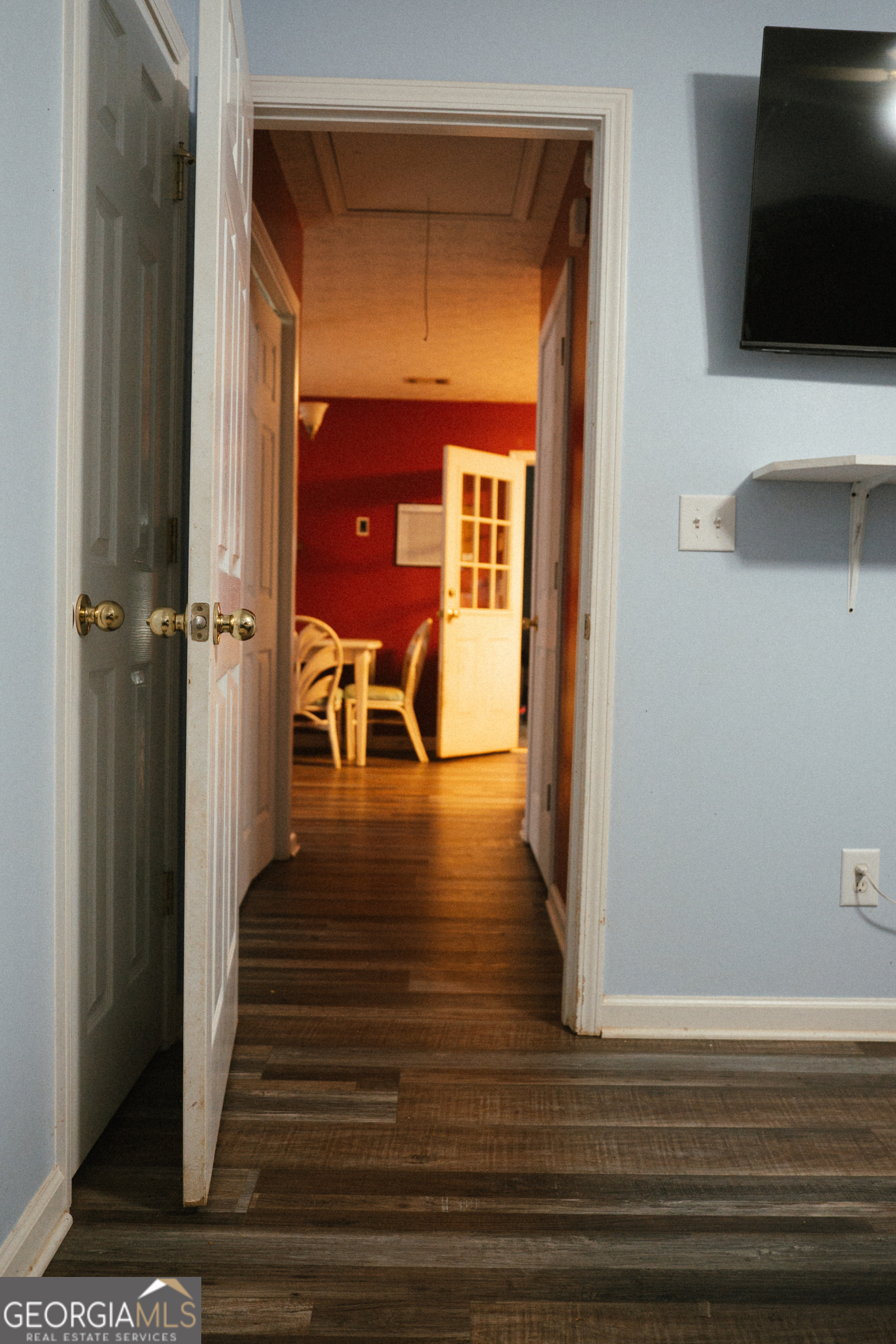 1145 Larkspur Drive Locust Grove, GA 30248 - Photo 8 of 15 a view of a hallway with wooden floor and windows