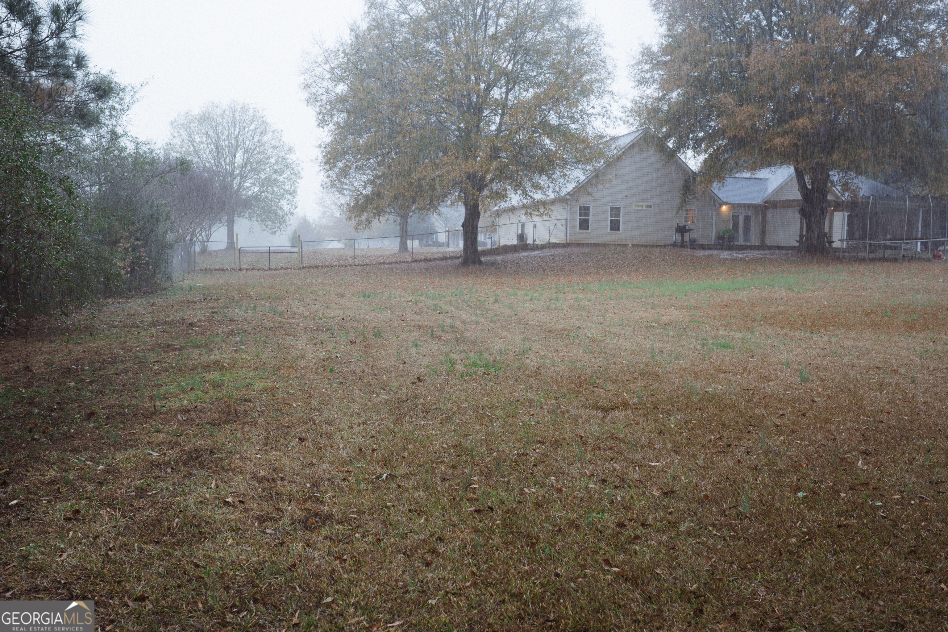 1145 Larkspur Drive Locust Grove, GA 30248 - Photo 9 of 15 a view of a yard with a tree