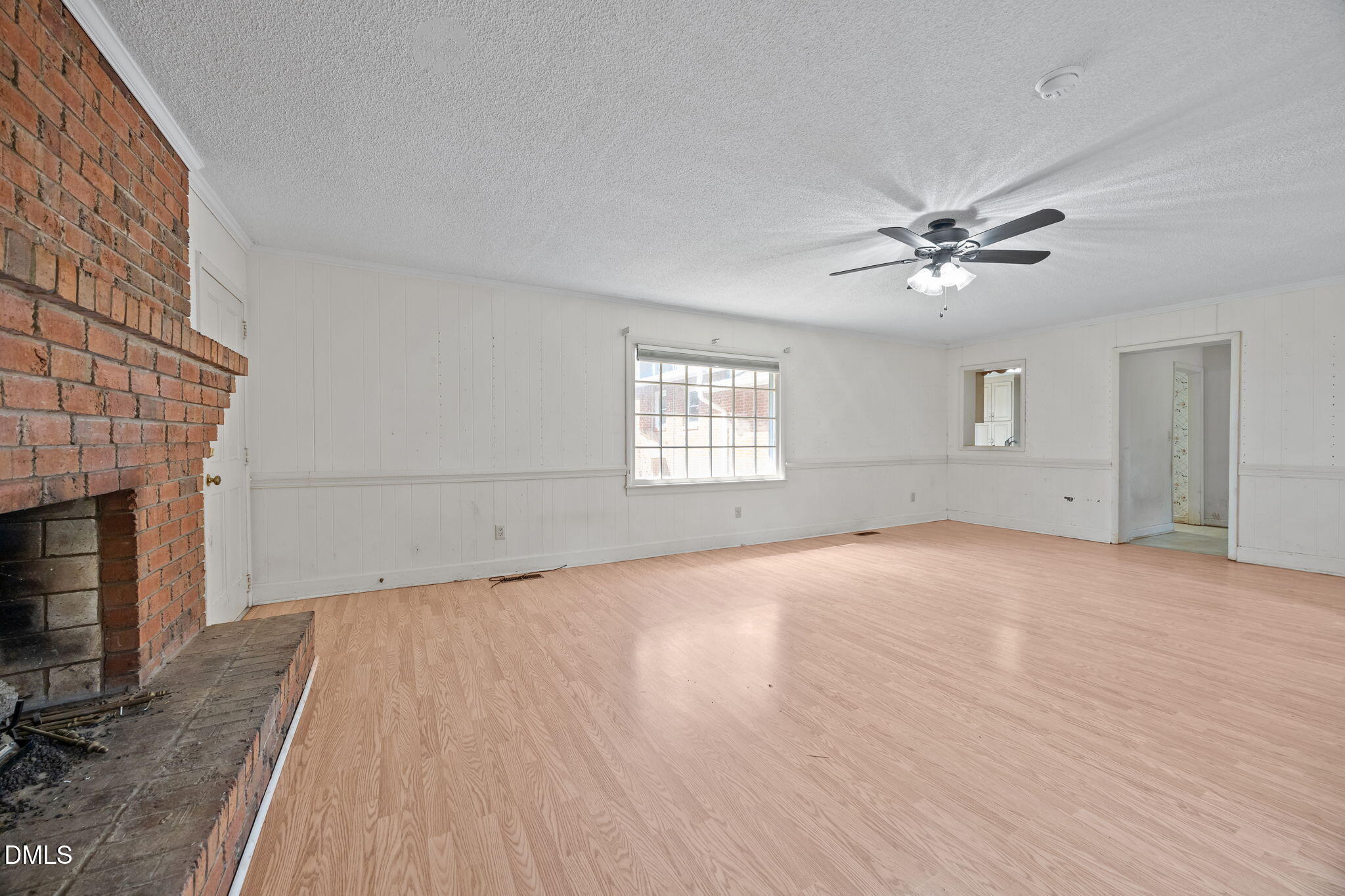 2009 Philcrest Road Raleigh, NC 27612 - Photo 11 of 29 an empty room with windows and fireplace