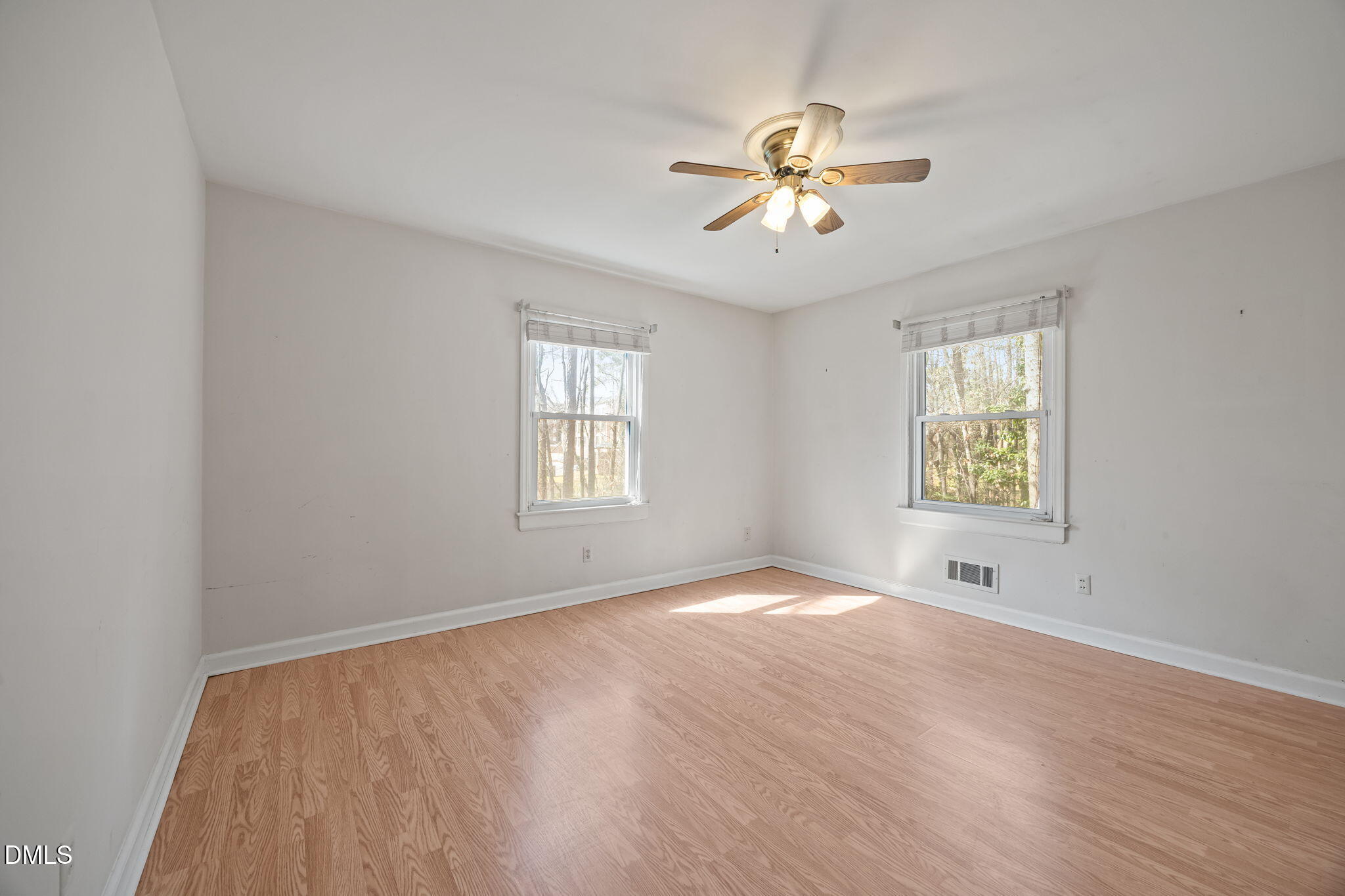 2009 Philcrest Road Raleigh, NC 27612 - Photo 14 of 29 wooden floor in an empty room with a window