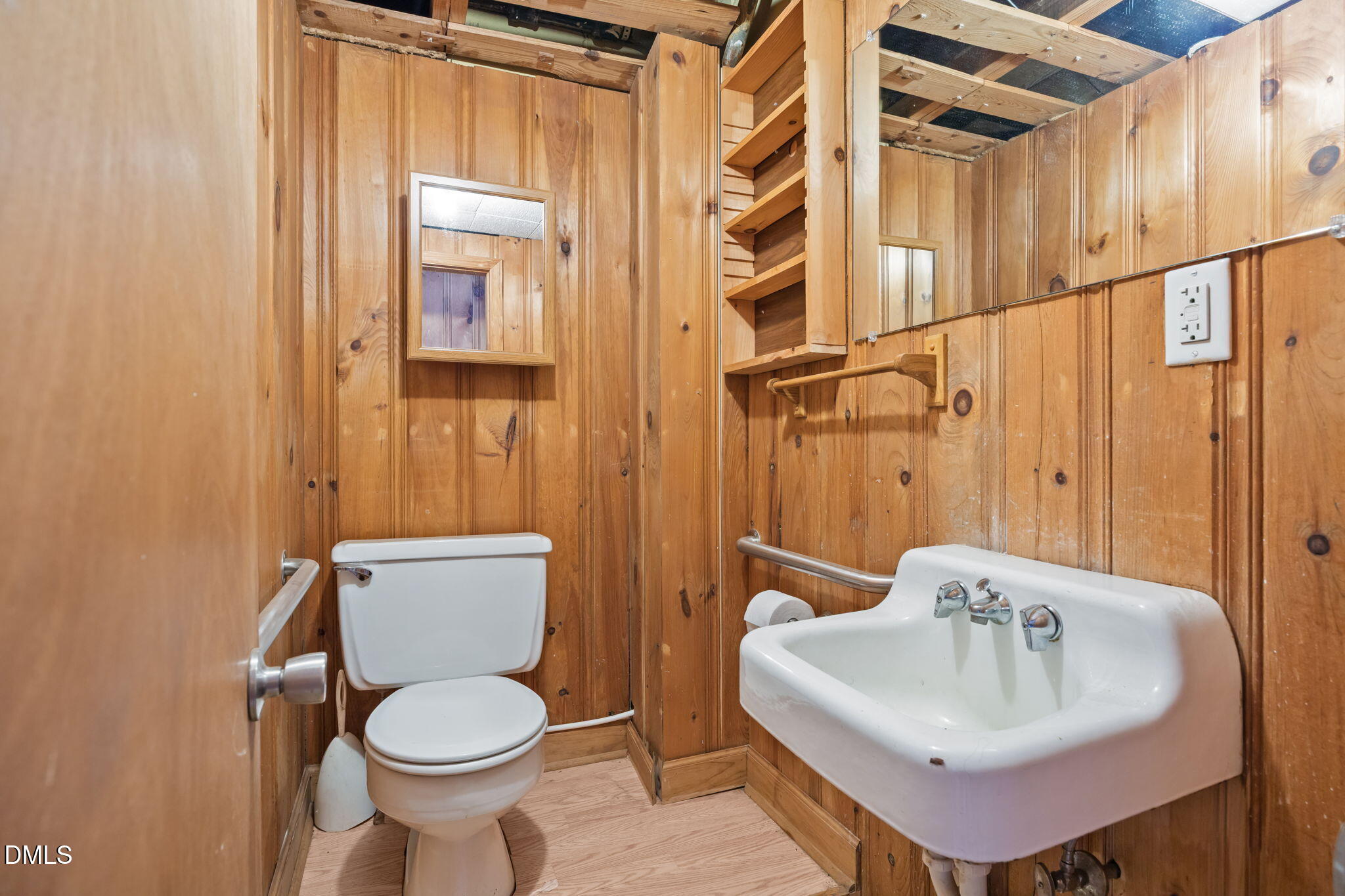 2009 Philcrest Road Raleigh, NC 27612 - Photo 17 of 29 a bathroom with a sink toilet and mirror