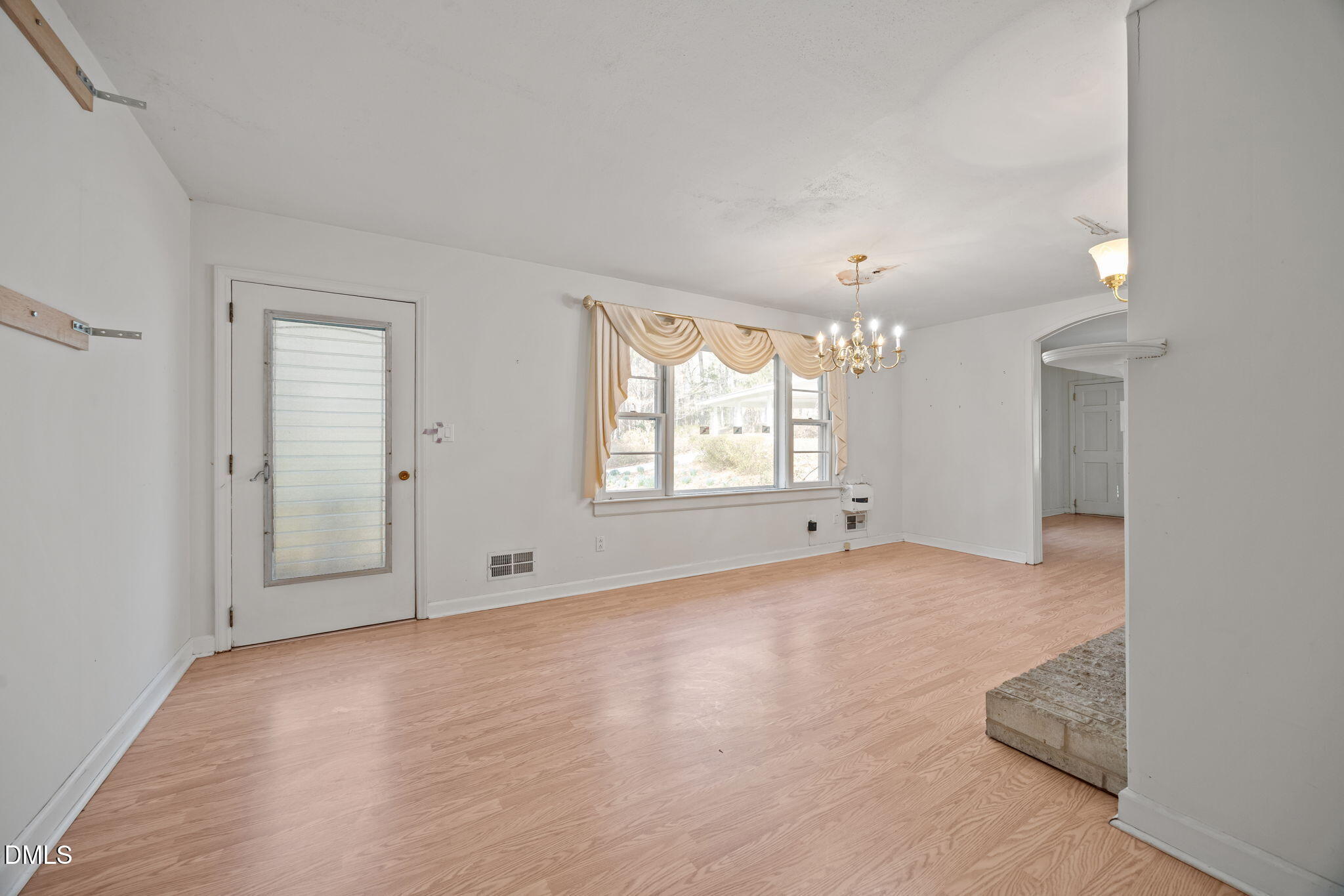 2009 Philcrest Road Raleigh, NC 27612 - Photo 20 of 29 wooden floor in an empty room with a window