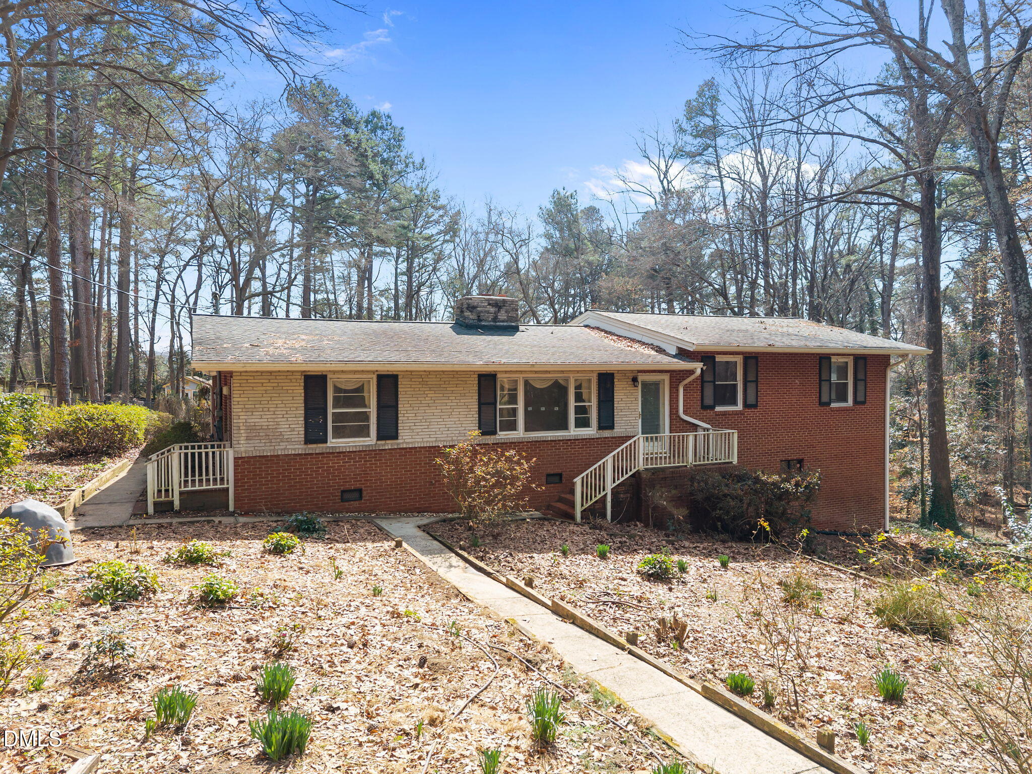 2009 Philcrest Road Raleigh, NC 27612 - Photo 2 of 29 a front view of a house with a yard covered in snow