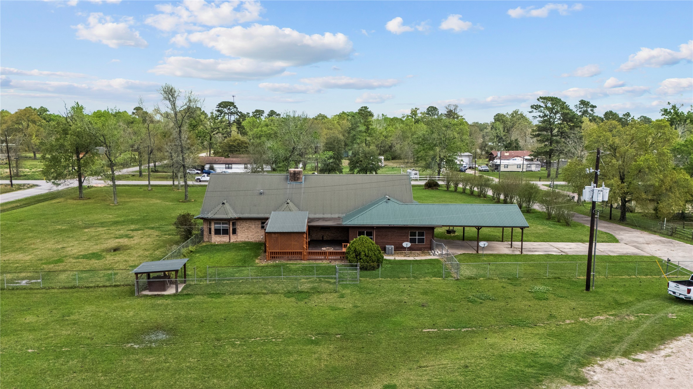 22916 East Martin Drive Porter, TX 77365 - Photo 40 of 43 a view of a house with a big yard and sitting area