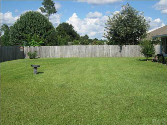 7165 Woodside Road Pensacola, FL 32526 - Photo 21 of 23 Side view of back yard. As you can see, this is a very spacious, yet low maintenance yard.
