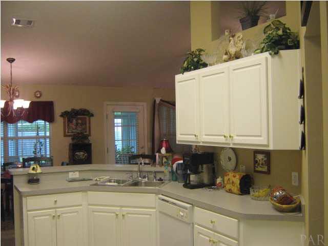 7165 Woodside Road Pensacola, FL 32526 - Photo 10 of 23 View of kitchen and breakfast bar.
