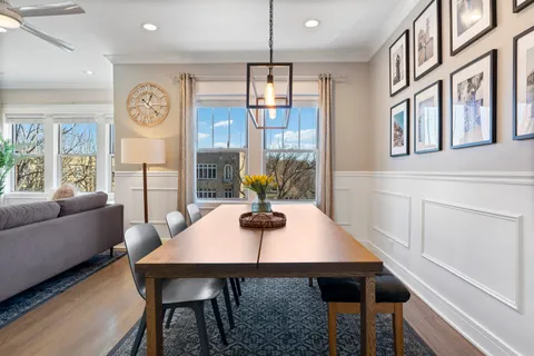 a dining room with furniture and window