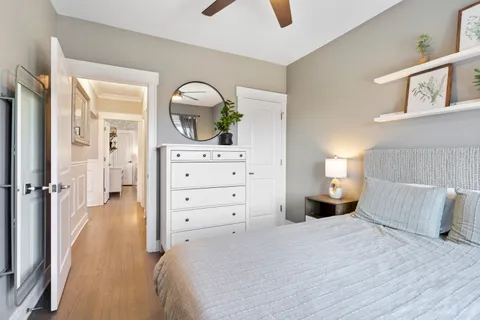 a bedroom with a bed and a dresser