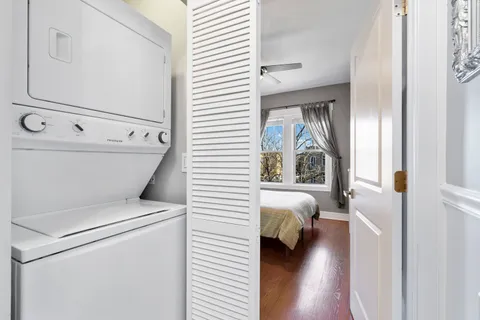 a view of washer and dryer with wooden floor