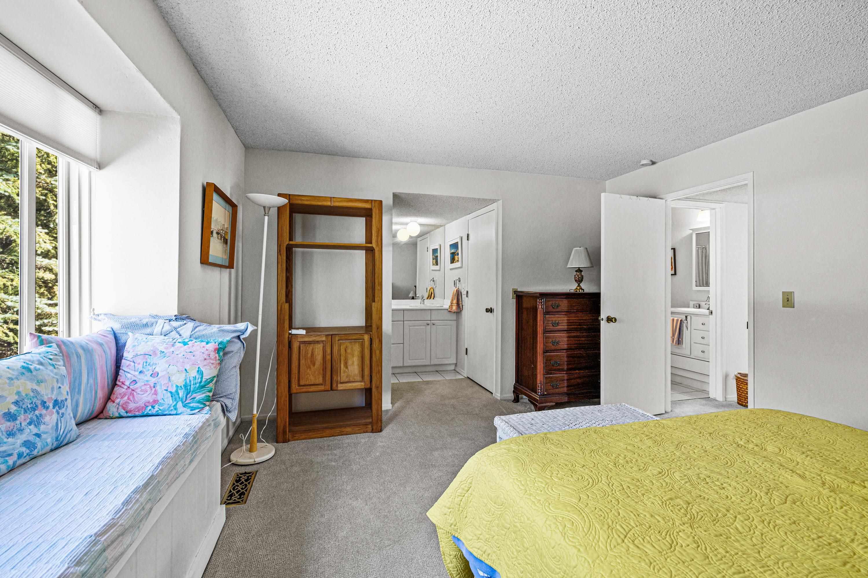 3101 Lake Forest Road, Unit 163 Tahoe City, CA 96145 - Photo 15 of 21 a bedroom with a bed and a couch