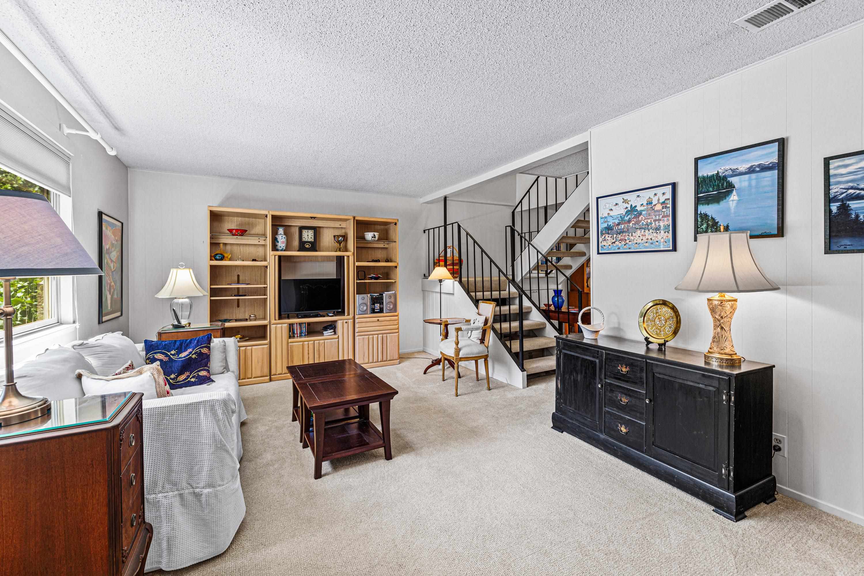 3101 Lake Forest Road, Unit 163 Tahoe City, CA 96145 - Photo 2 of 21 a living room with furniture and a bookshelf