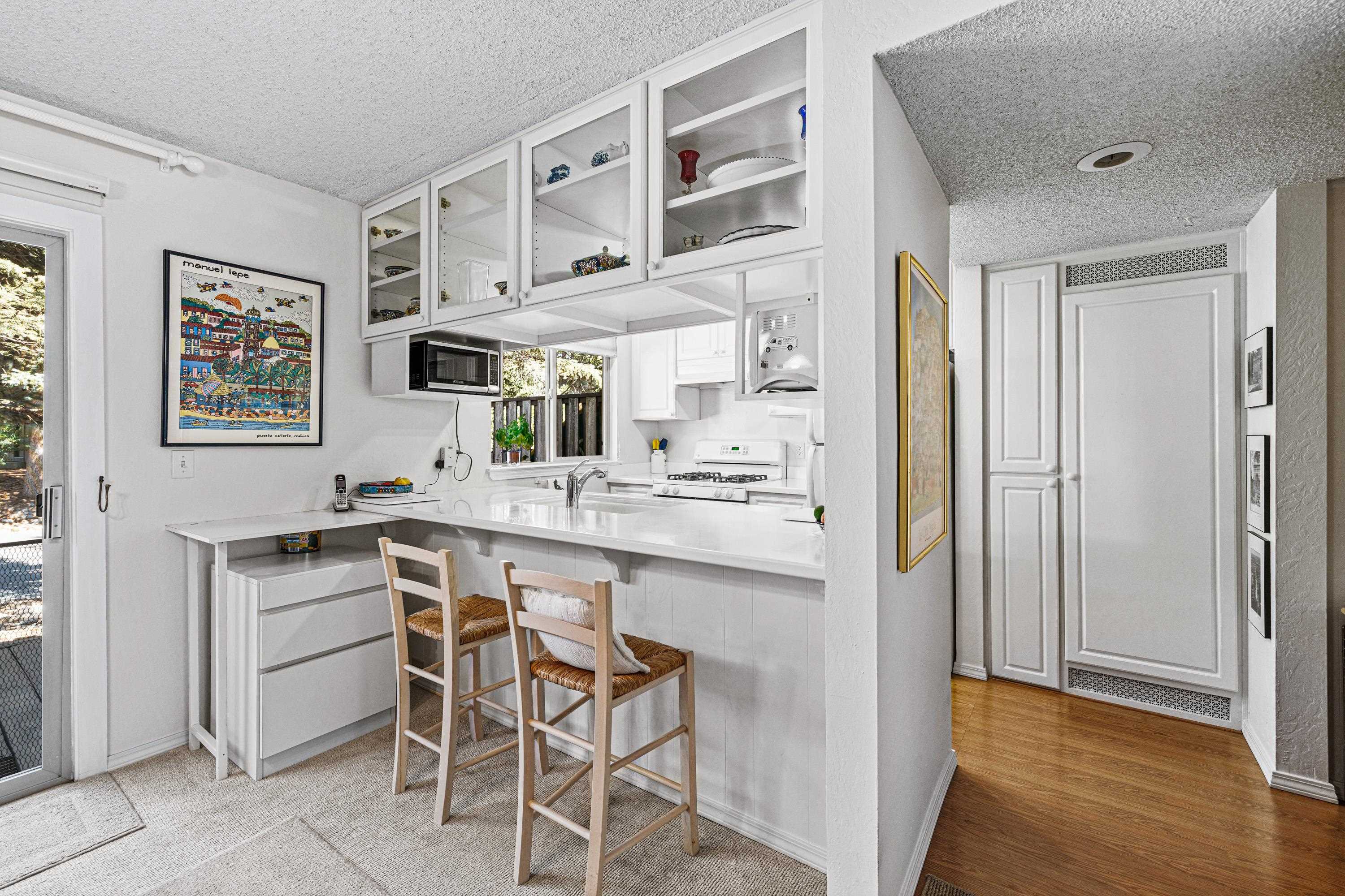 3101 Lake Forest Road, Unit 163 Tahoe City, CA 96145 - Photo 8 of 21 a kitchen with stainless steel appliances granite countertop a refrigerator and a stove top oven