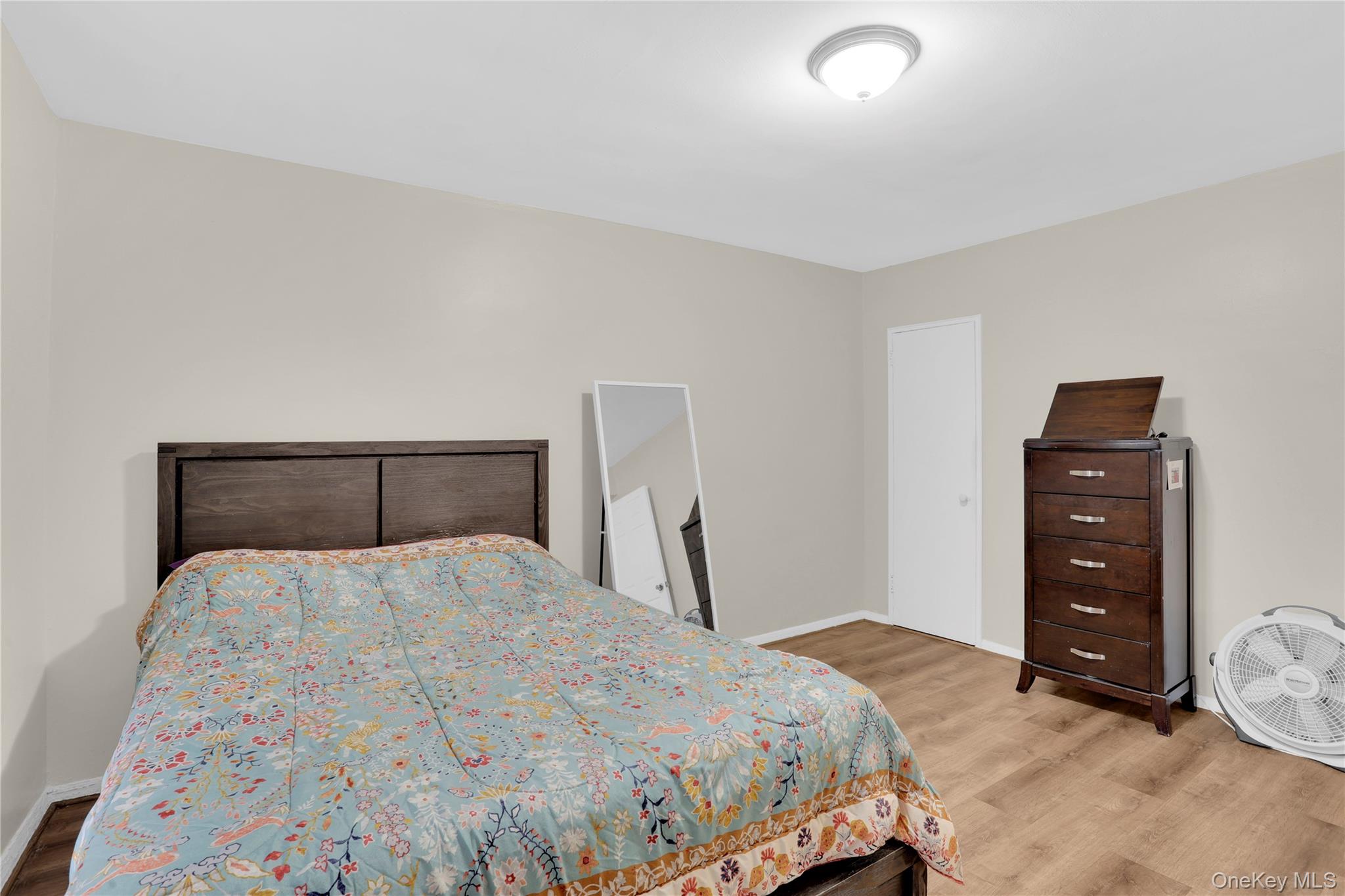 245 Bronx River Road, Unit 7C Yonkers, NY 10704 - Photo 15 of 23 a bedroom with a bed and a dresser