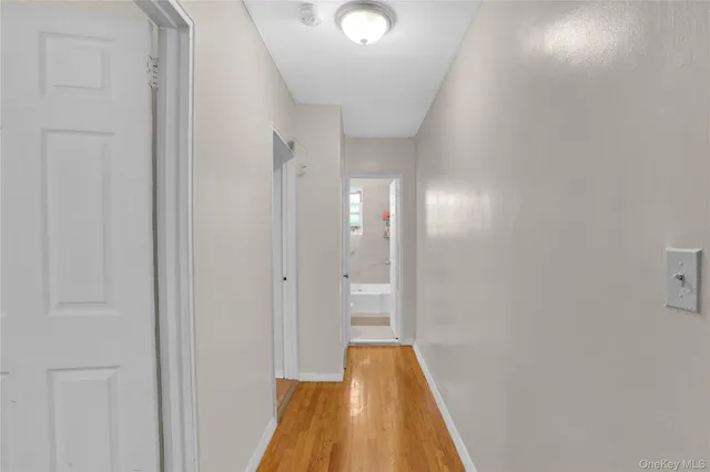 a view of a bathroom with a sink and a mirror