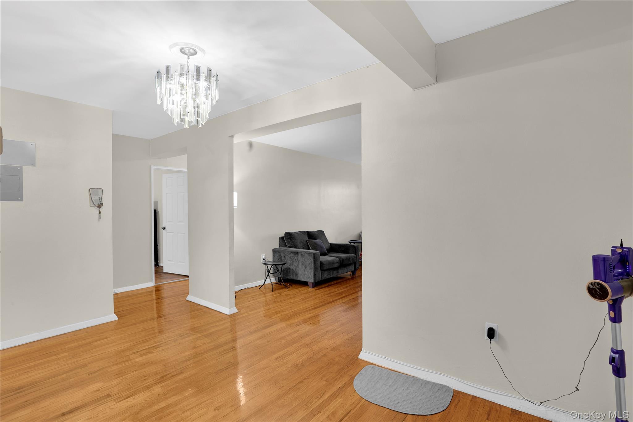 245 Bronx River Road, Unit 7C Yonkers, NY 10704 - Photo 5 of 23 a bedroom with a bed and wooden floor