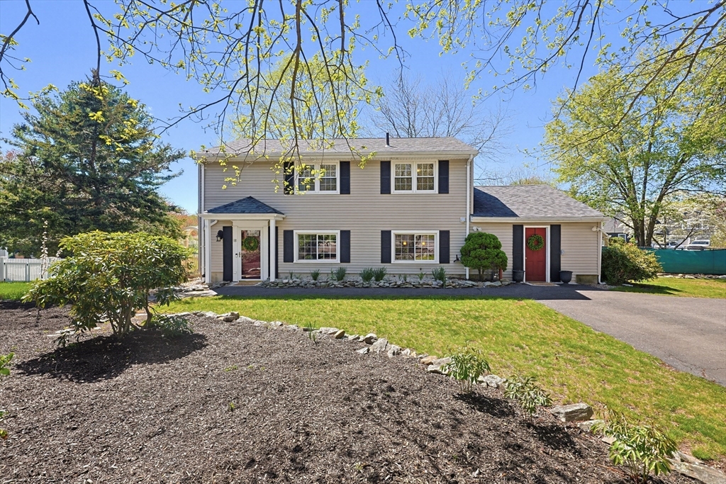 a view of house with outdoor space and trees