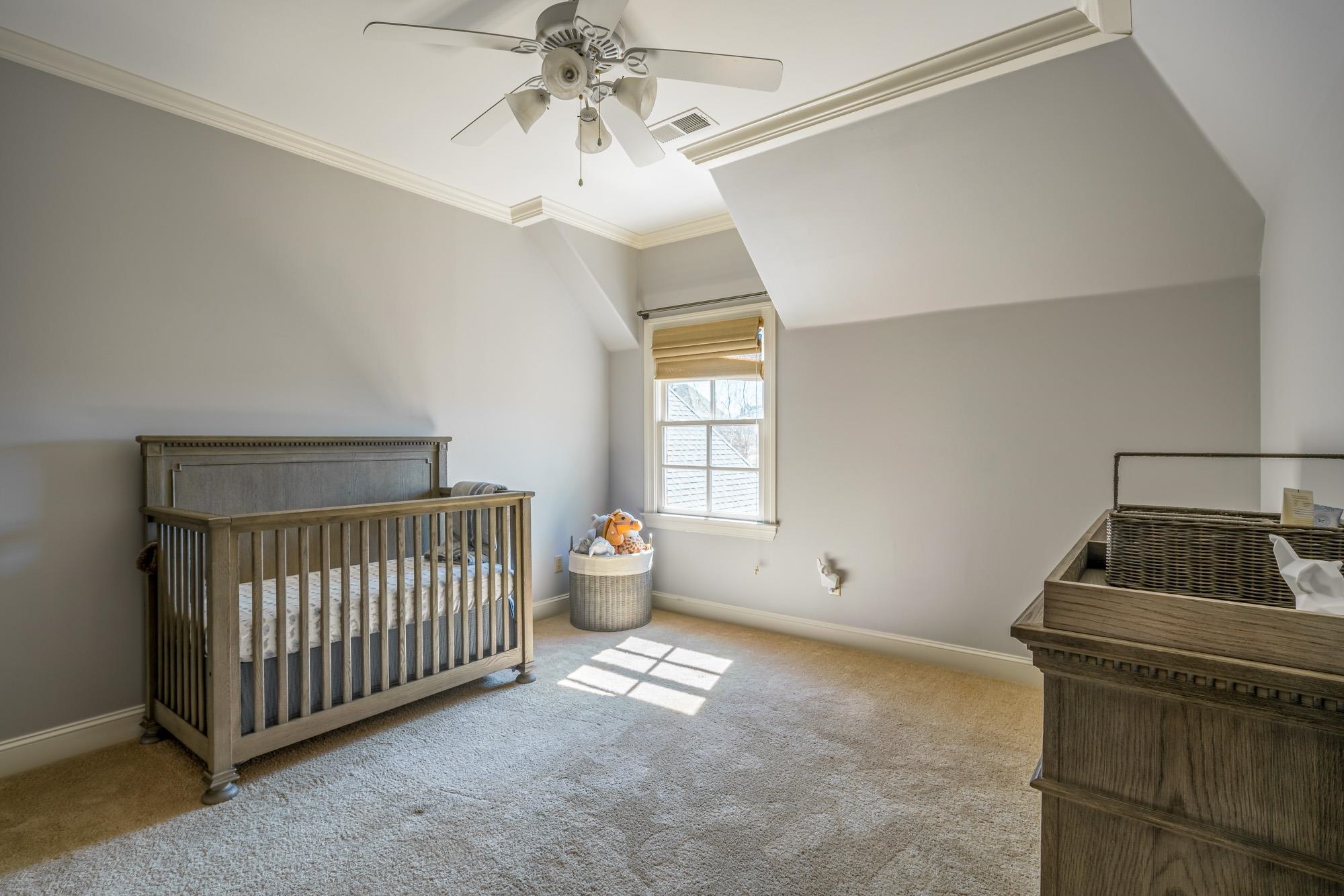 1247 Braywind Drive Collierville, TN 38017 - Photo 17 of 25 a bedroom with a bed and window