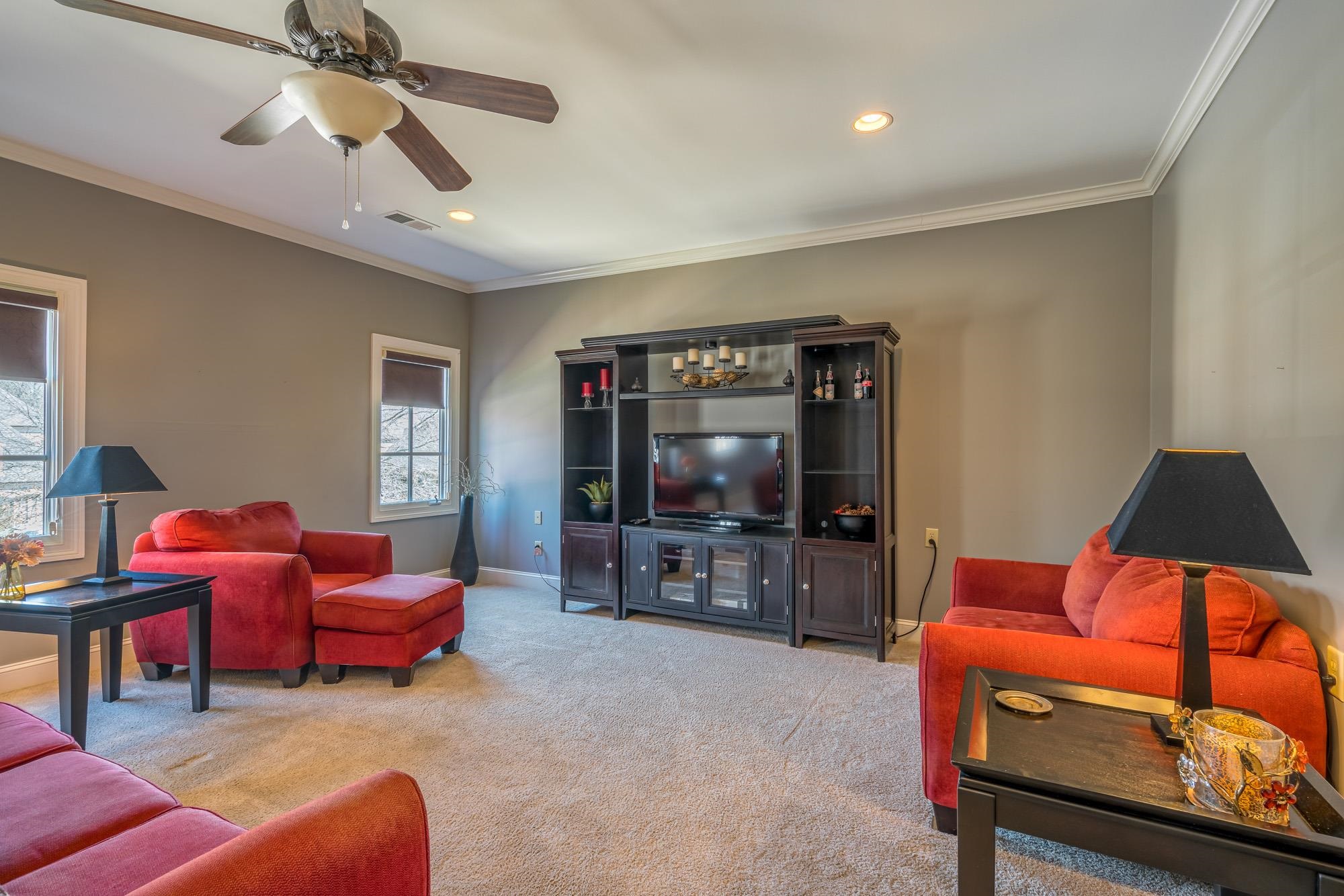 1247 Braywind Drive Collierville, TN 38017 - Photo 19 of 25 a living room with furniture and a flat screen tv
