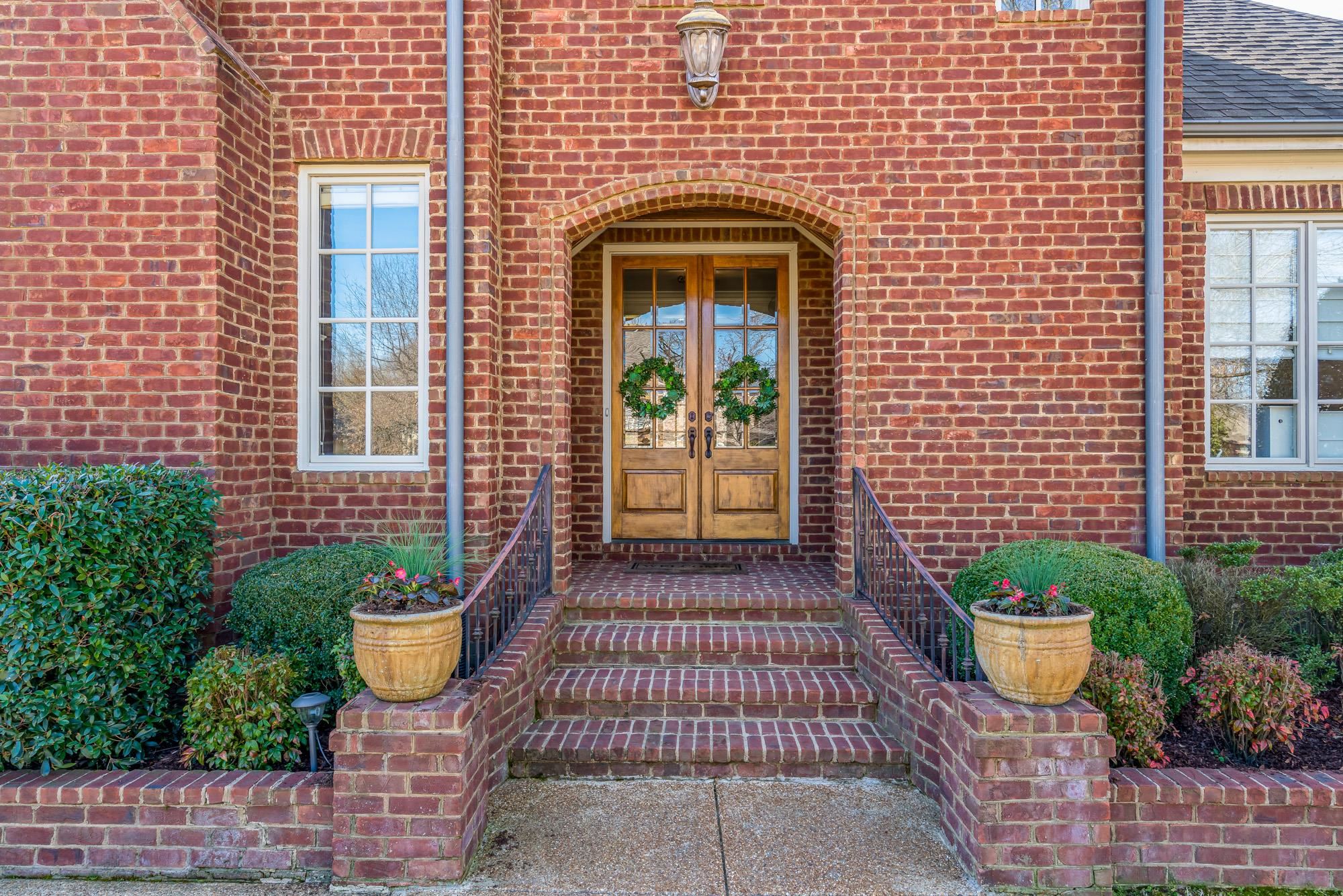 1247 Braywind Drive Collierville, TN 38017 - Photo 2 of 25 a front view of a house with plants