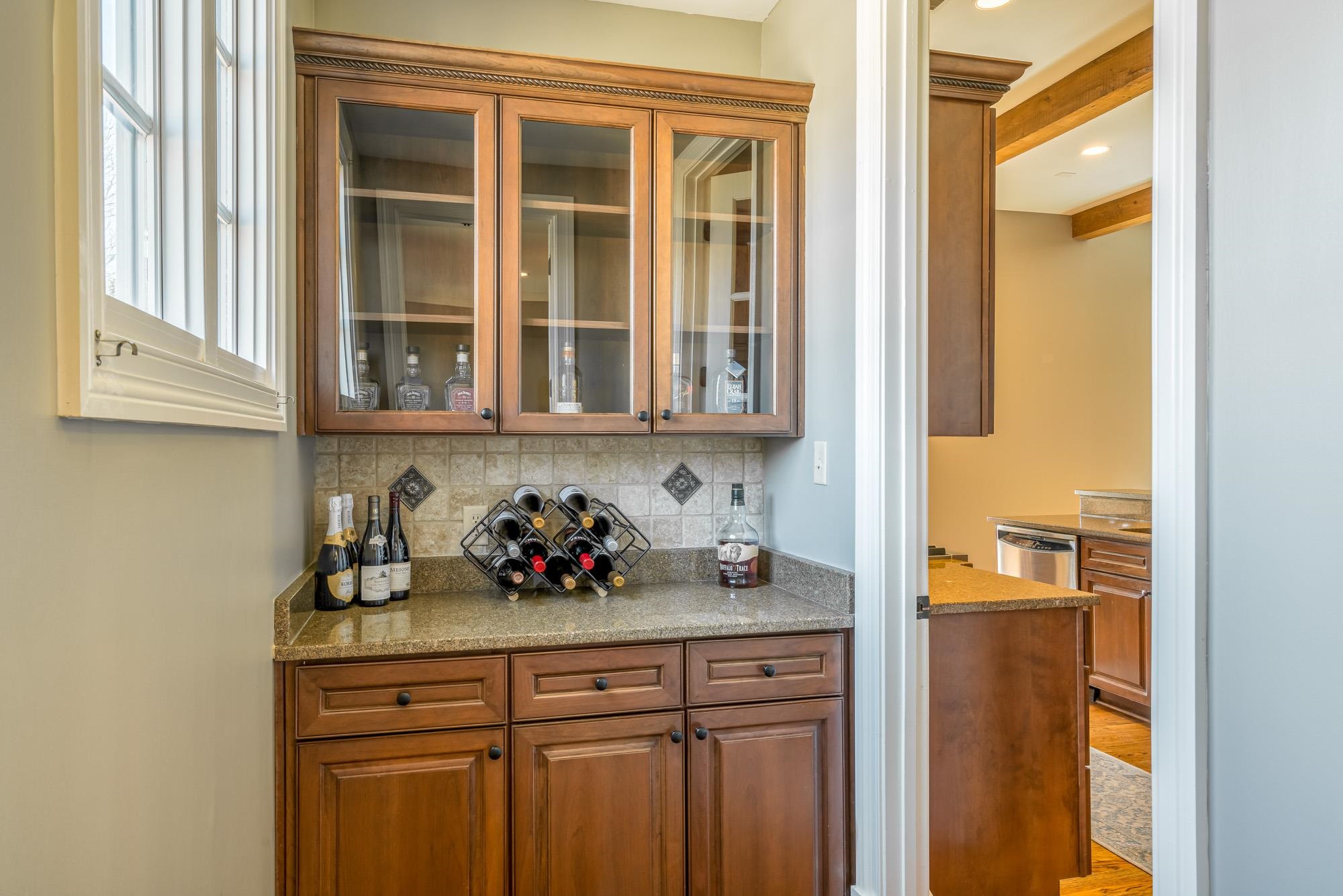 1247 Braywind Drive Collierville, TN 38017 - Photo 21 of 25 a kitchen with a sink cabinets and a window