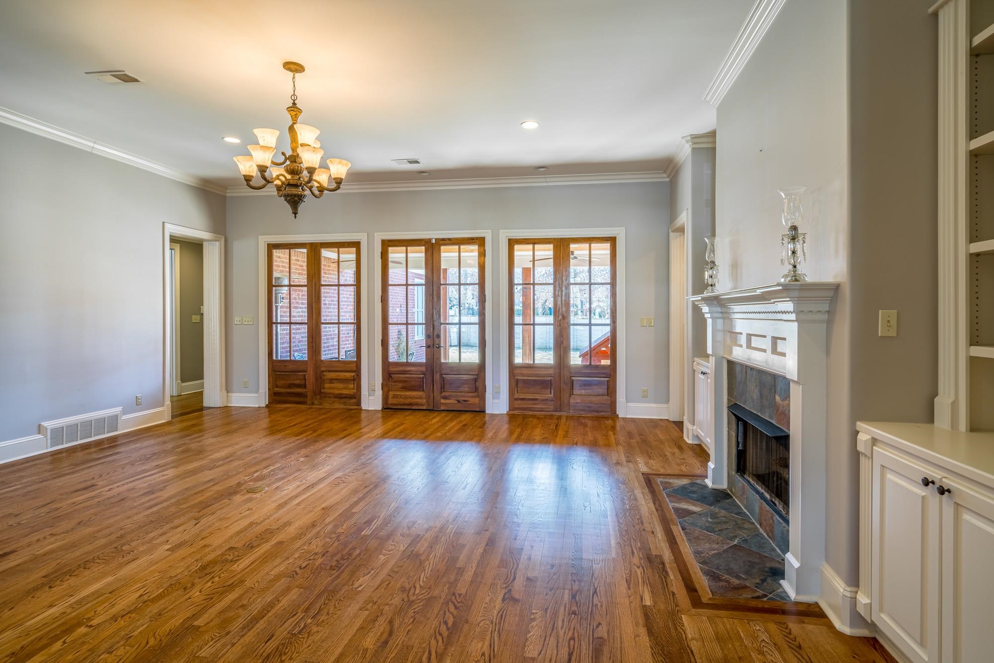 1247 Braywind Drive Collierville, TN 38017 - Photo 4 of 25 a view of an empty room with wooden floor and a window