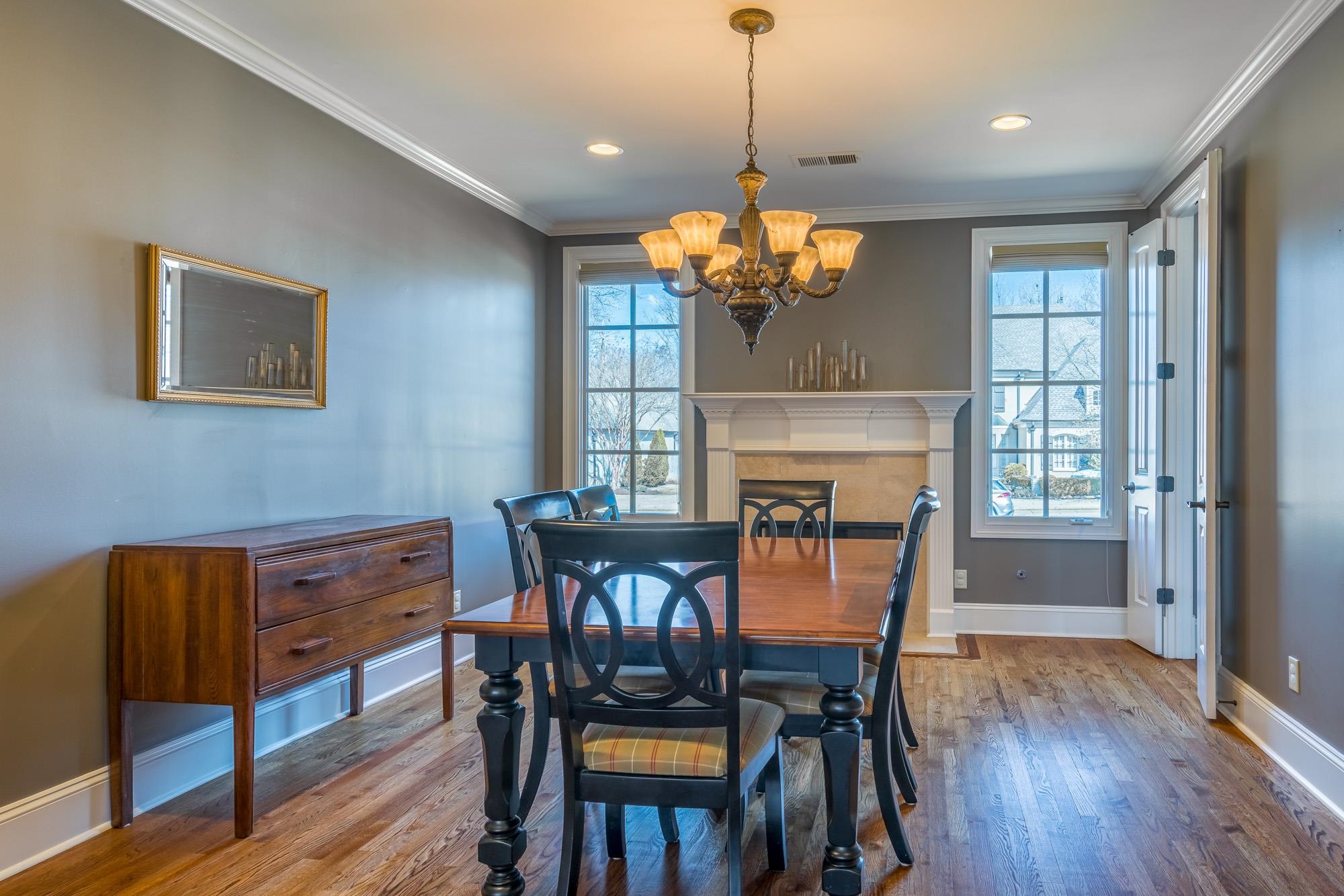 1247 Braywind Drive Collierville, TN 38017 - Photo 6 of 25 a view of a dining room with furniture wooden floor and chandelier
