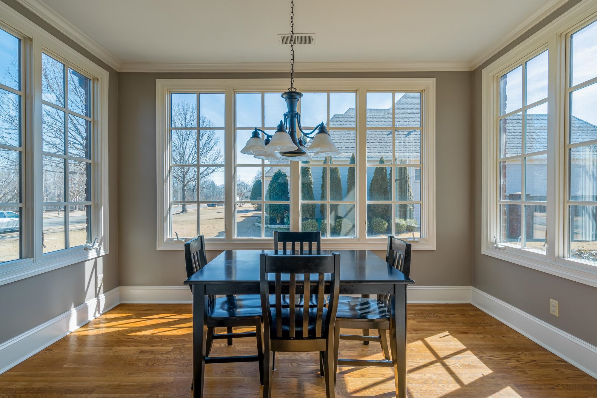 1247 Braywind Drive Collierville, TN 38017 - Photo 9 of 25 a view of a dining room with furniture window and wooden floor
