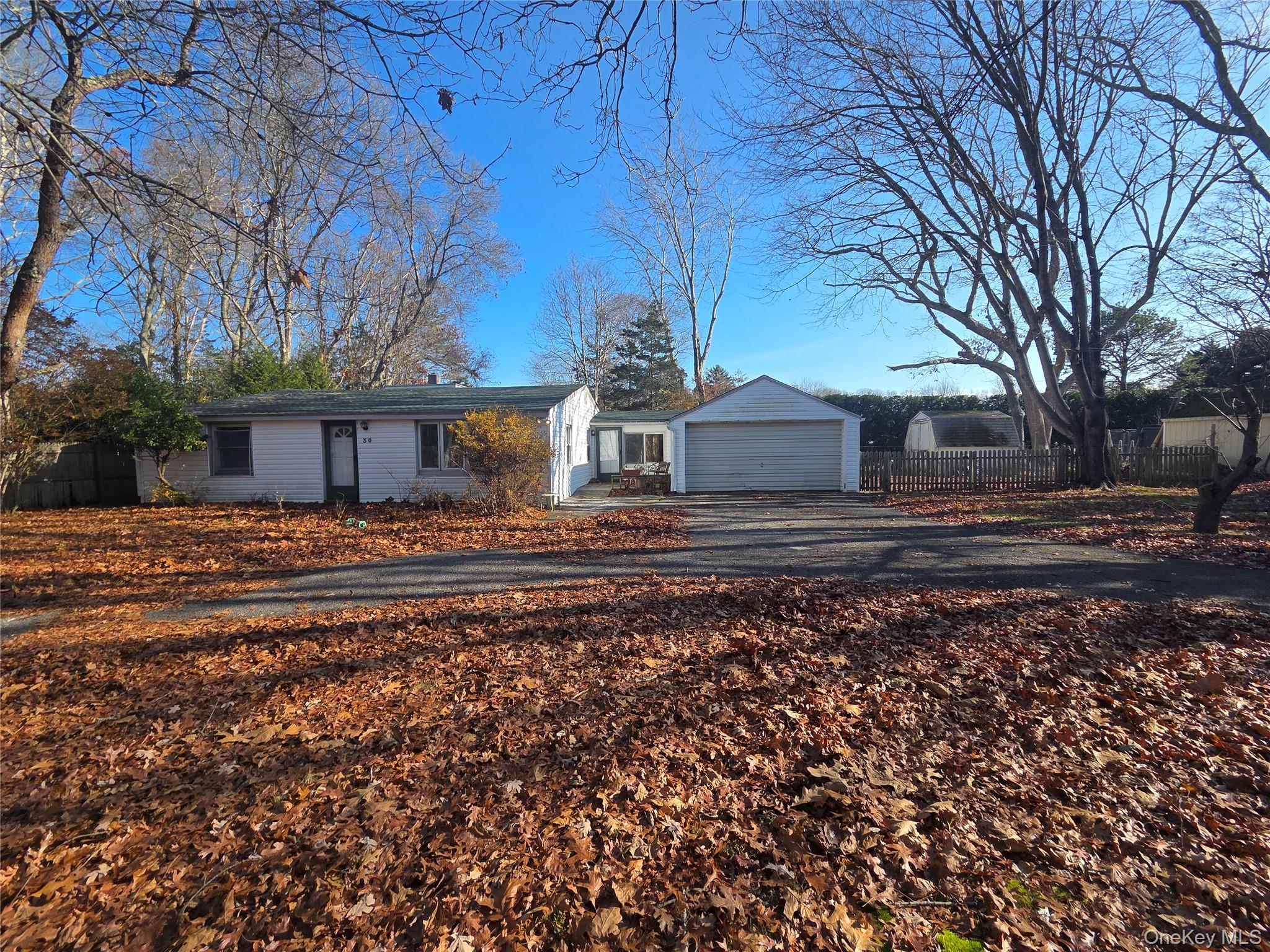 30 Matthews Drive Remsenburg, NY 11960 - Photo 2 of 11 a front view of a house with a yard