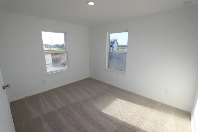 an empty room with windows