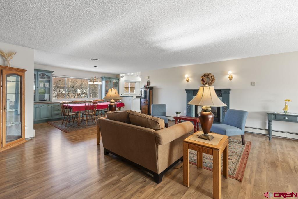 2135 Winston Way, Unit A Montrose, CO 81401 - Photo 19 of 27 a living room with furniture and wooden floor