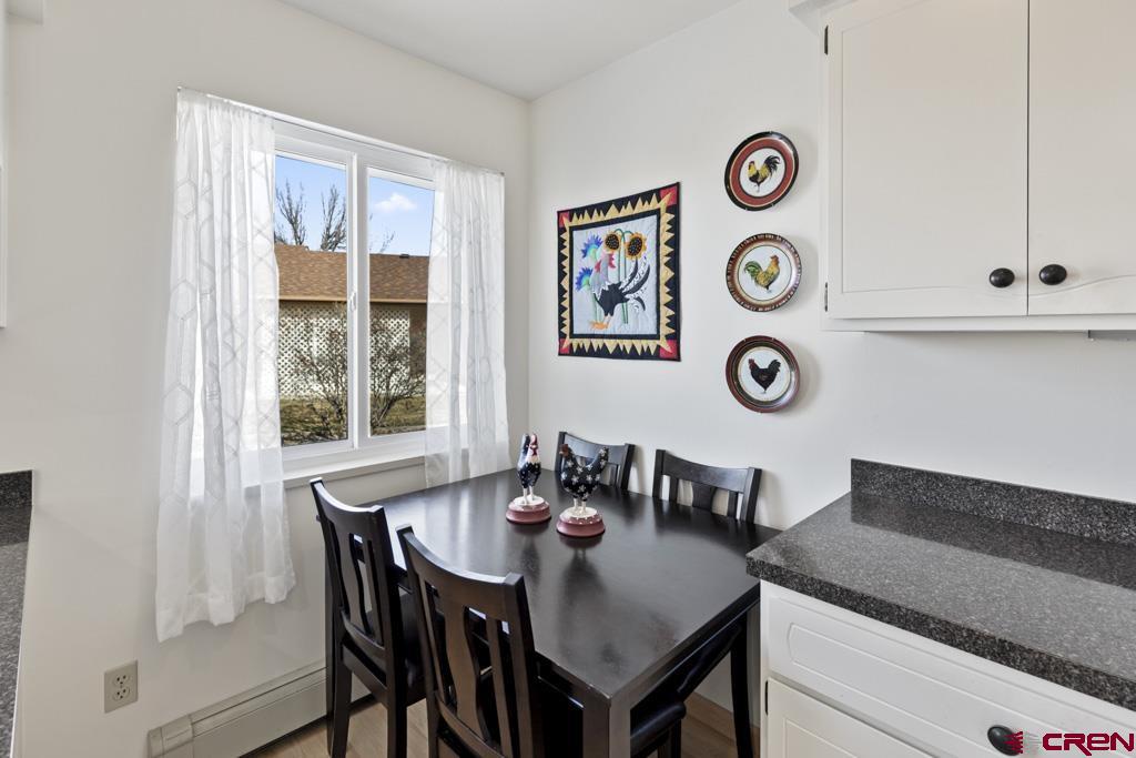 2135 Winston Way, Unit A Montrose, CO 81401 - Photo 2 of 27 a view of a dining area with furniture and a large window