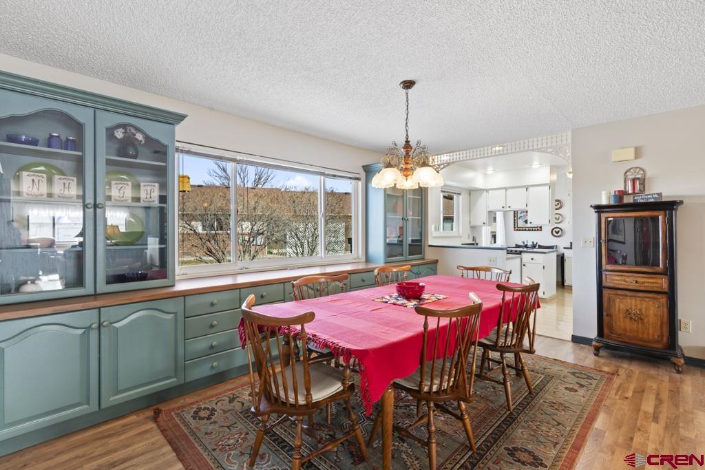 2135 Winston Way, Unit A Montrose, CO 81401 - Photo 23 of 27 a view of a dining room with furniture window and outside view
