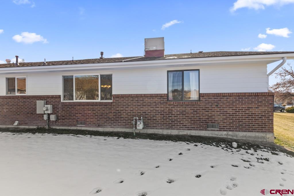 2135 Winston Way, Unit A Montrose, CO 81401 - Photo 25 of 27 a front view of a house